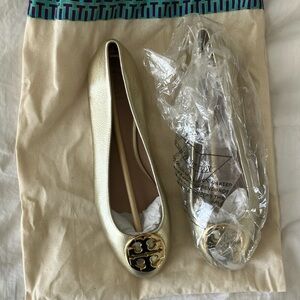 Never worn gold Tory Burch ballet flats